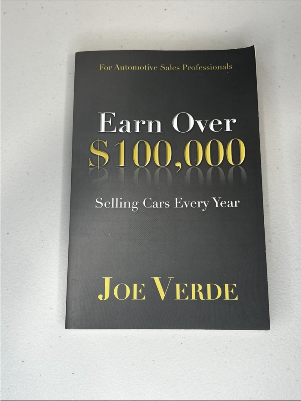 Earn Over $100,000 Selling Cars Every Year by Joe Verde - Black & Gold Paperback